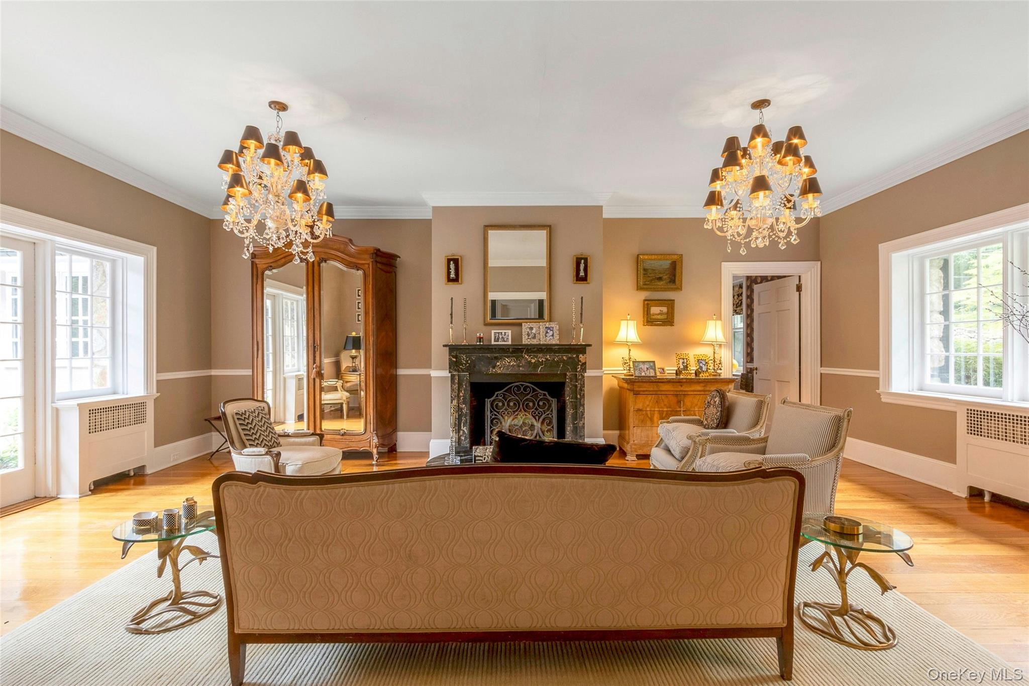 55 Mountain Farm Road Tuxedo Park, NY 10987 - Photo 6 of 42 a living room with fireplace furniture and a chandelier