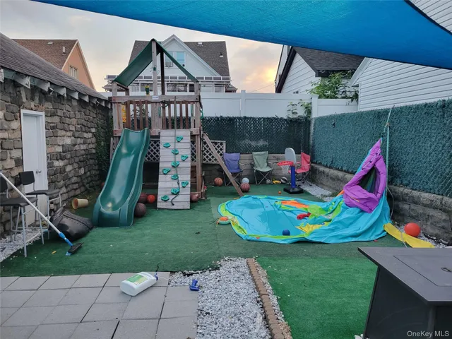 a childrens park with lots of swings and slides