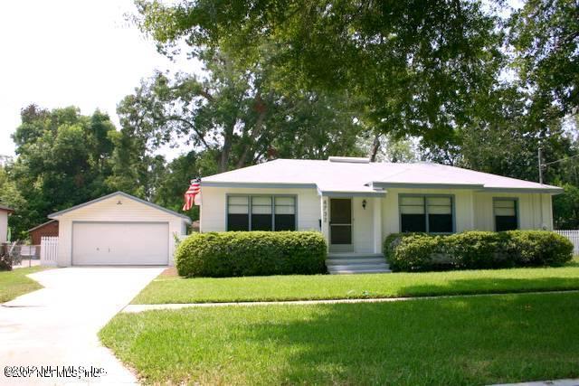 4732 Sunderland Road Jacksonville, FL 32210 - Photo 1 of 15 a front view of a house with a garden