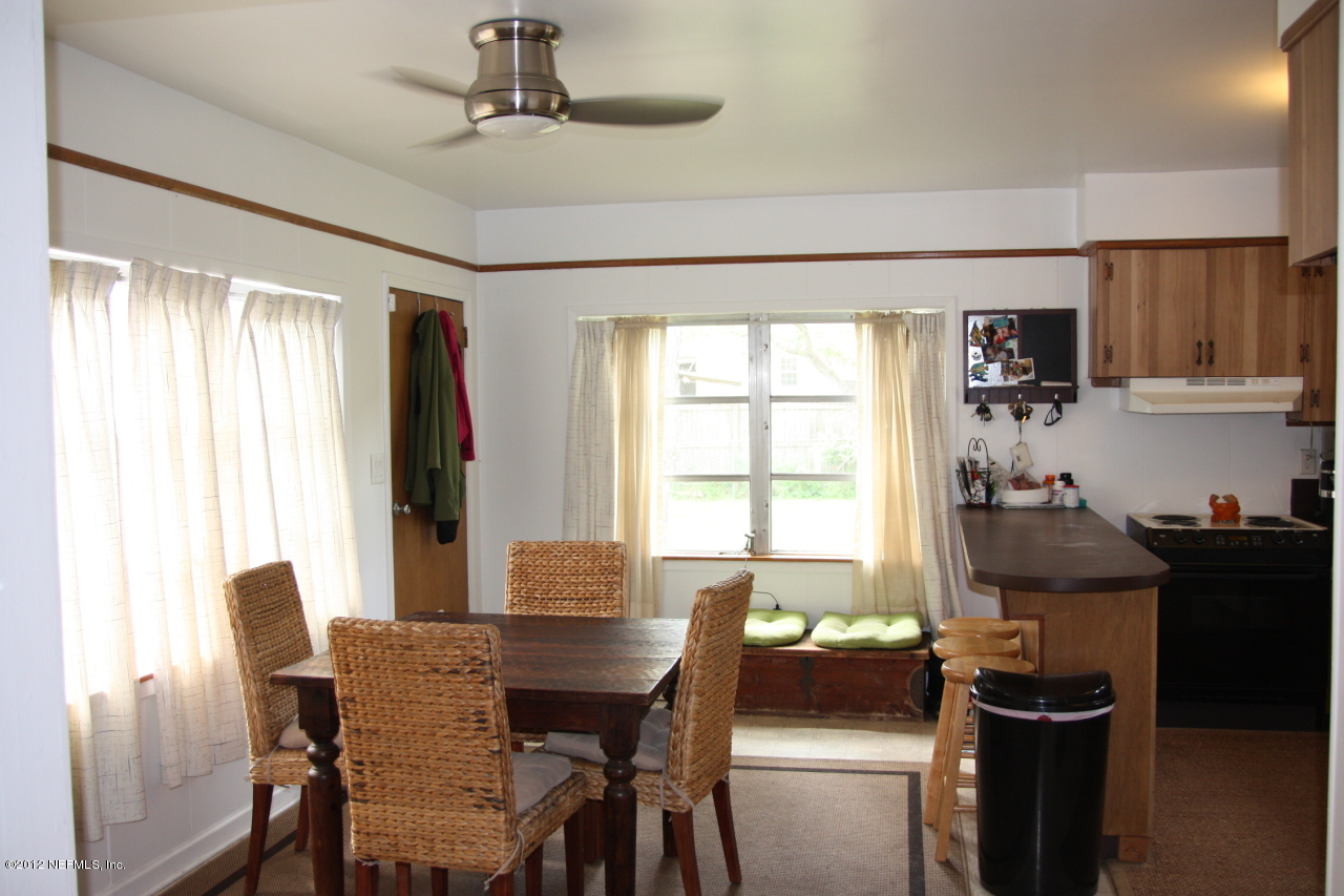 4732 Sunderland Road Jacksonville, FL 32210 - Photo 5 of 15 a view of a dining room with furniture window and outside view