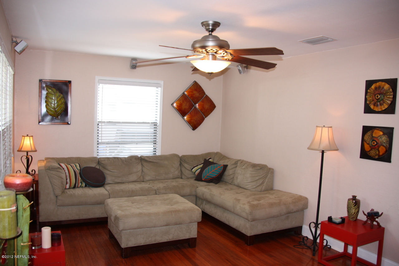 4732 Sunderland Road Jacksonville, FL 32210 - Photo 6 of 15 a living room with furniture a rug and a window