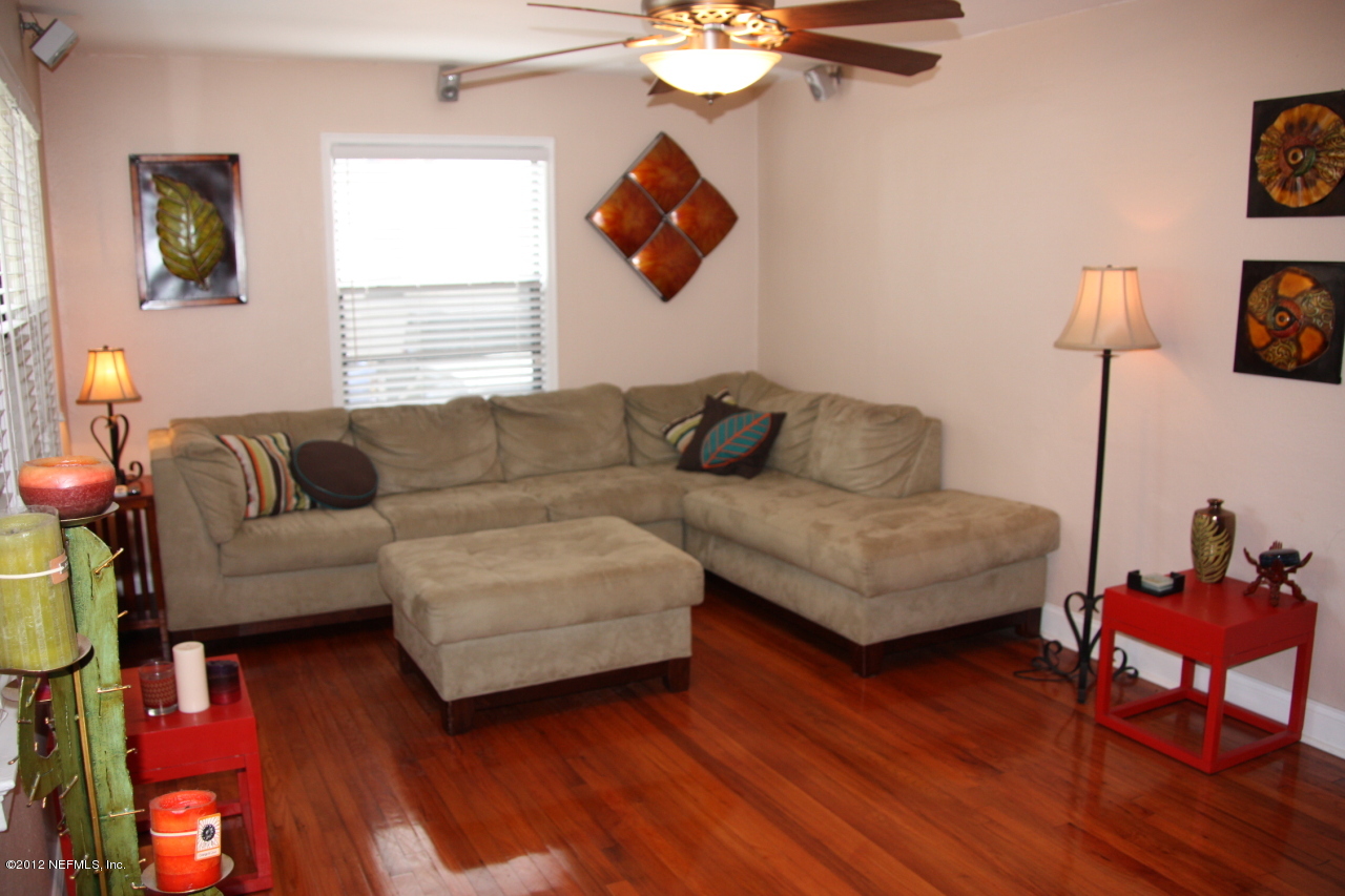 4732 Sunderland Road Jacksonville, FL 32210 - Photo 7 of 15 a living room with furniture and a wooden floor