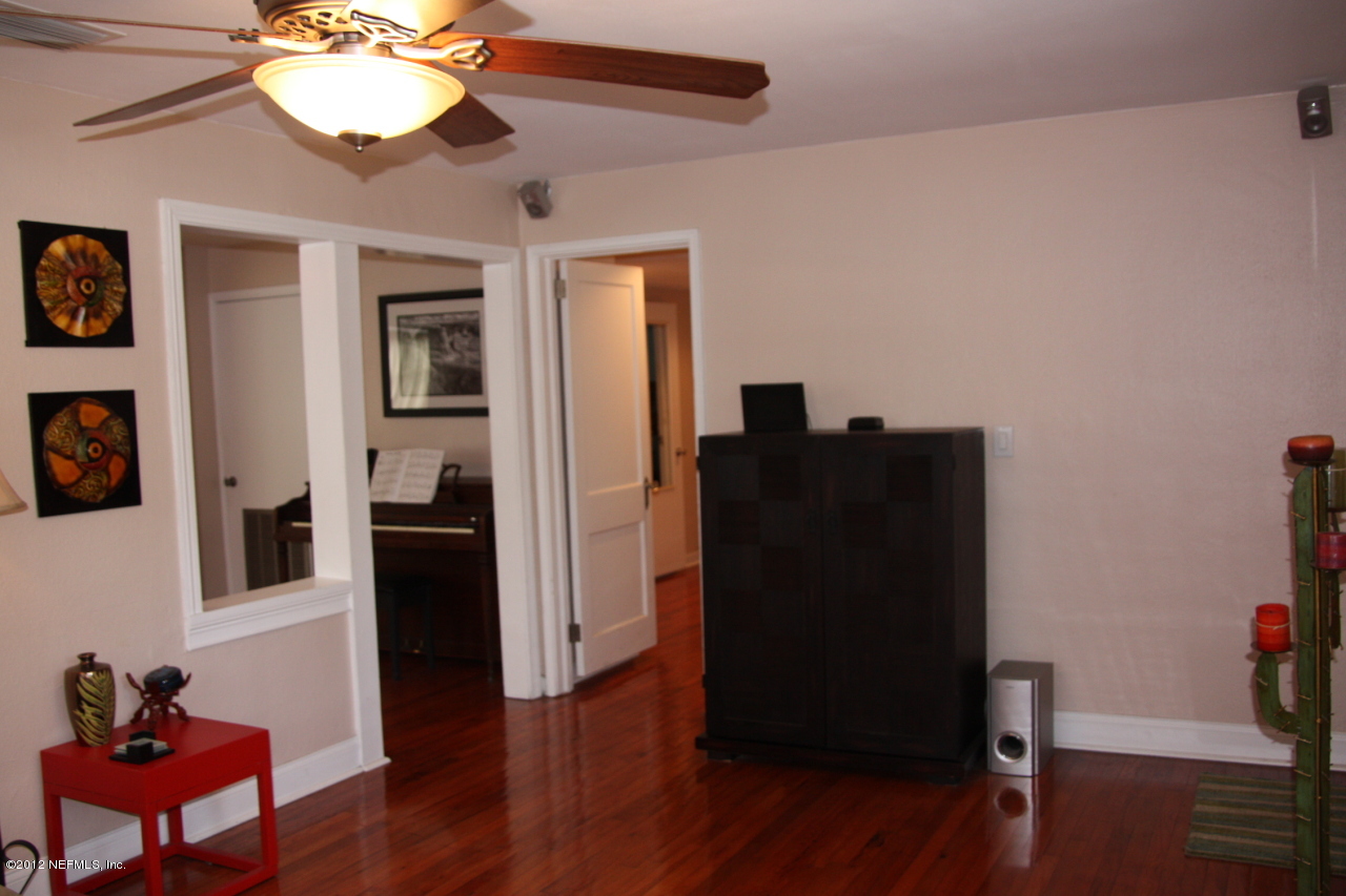 4732 Sunderland Road Jacksonville, FL 32210 - Photo 8 of 15 a view of a workspace with furniture and wooden floor