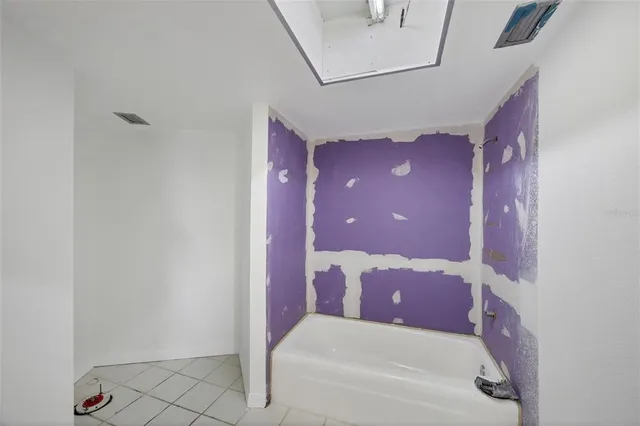 a view of an empty room and window