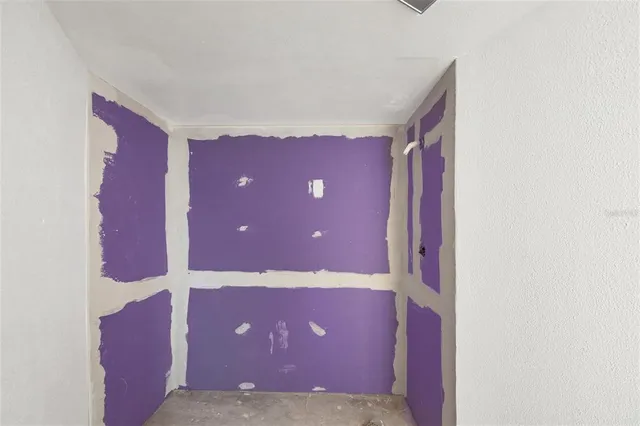 a view of a garden with a building in the background