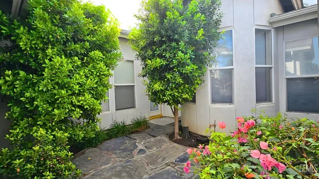 a view of an empty room with a staircase