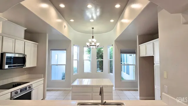 a view of empty room with wooden floor and fireplace