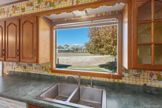 a kitchen with a stove and a sink