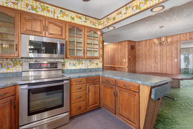 a view of a kitchen with washer and dryer