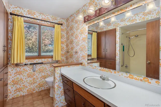 a bathroom with a shower and a shower curtain