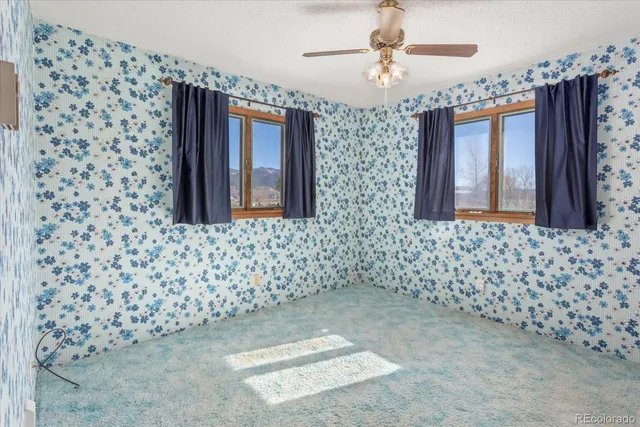 a view of a hallway to rooms