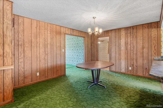 a view of a livingroom with furniture window and wooden floor