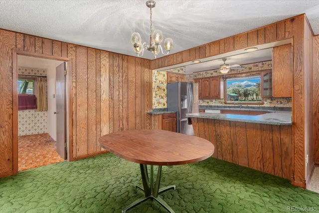 a kitchen with granite countertop a sink and a stove