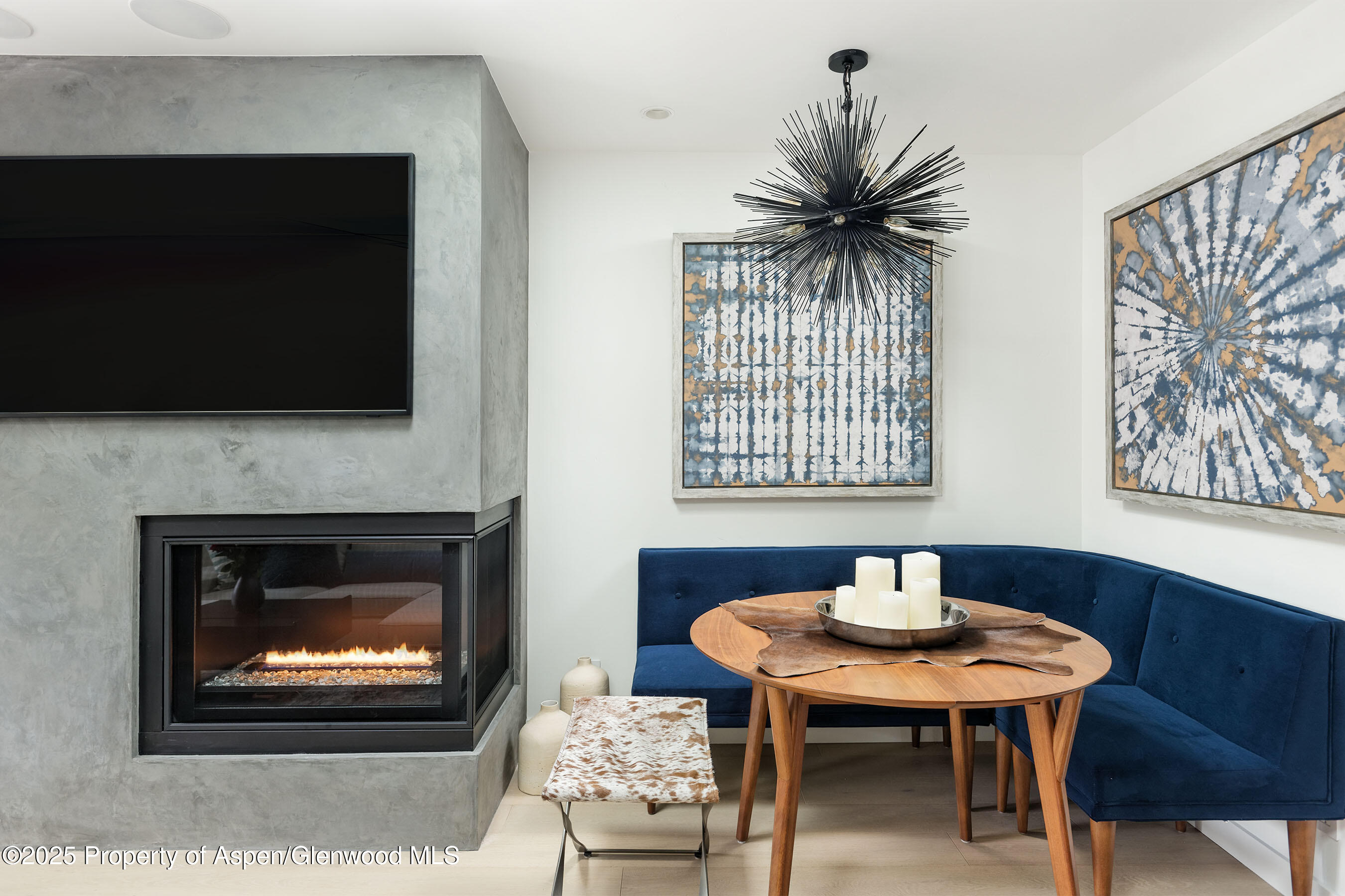 450 South Original Street, Unit 8 Aspen, CO 81611 - Photo 11 of 19 a living room with furniture a fireplace and a flat screen tv