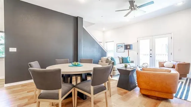 a view of a dining room with furniture window and wooden floor