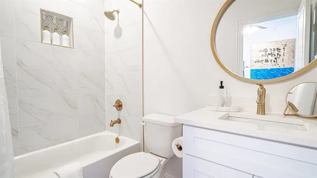 a bathroom with a sink a toilet and a bathtub