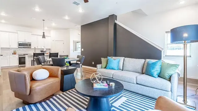 a living room with furniture and a rug