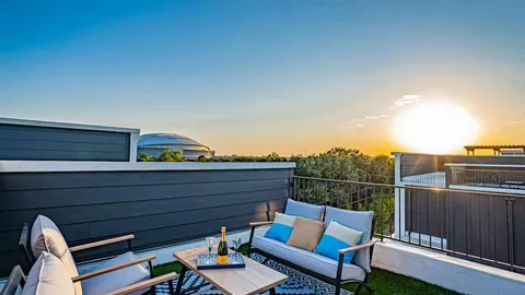 a view of sitting area on roof with furniture