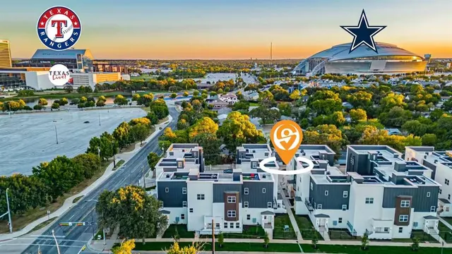 an aerial view of residential houses with outdoor space