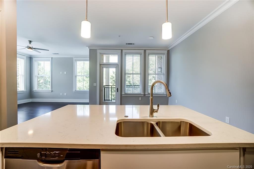 830 Providence Road, Unit 303 Charlotte, NC 28207 - Photo 13 of 39 a kitchen with a sink and a window