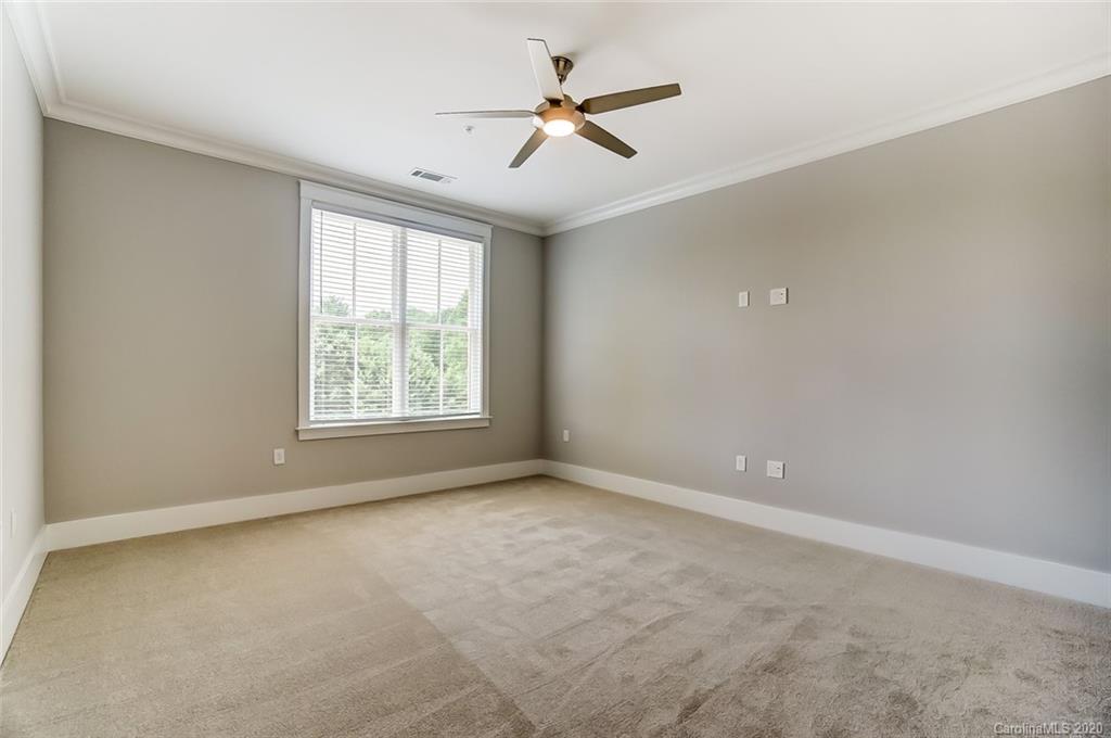 830 Providence Road, Unit 303 Charlotte, NC 28207 - Photo 22 of 39 a view of an empty room with a window