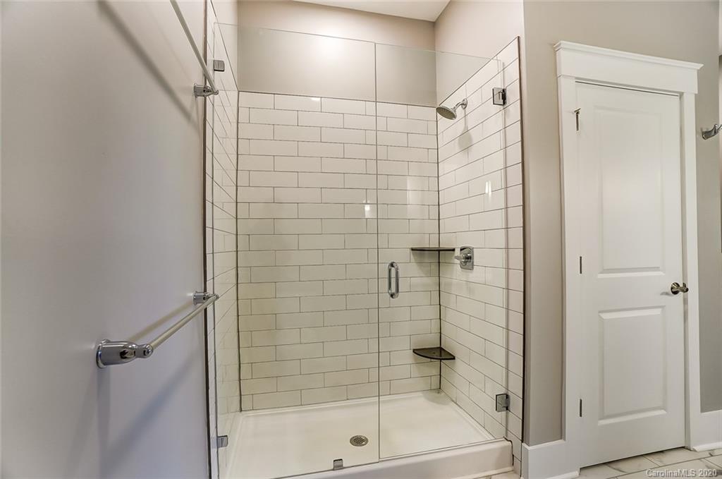 830 Providence Road, Unit 303 Charlotte, NC 28207 - Photo 27 of 39 a bathroom with a shower