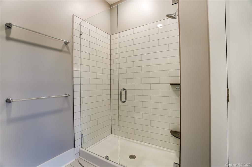 830 Providence Road, Unit 303 Charlotte, NC 28207 - Photo 28 of 39 a bathroom with a shower