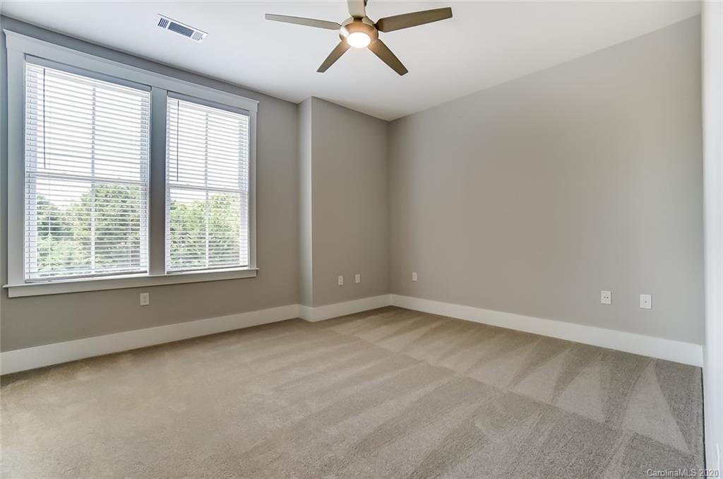 830 Providence Road, Unit 303 Charlotte, NC 28207 - Photo 30 of 39 a view of an empty room with a window