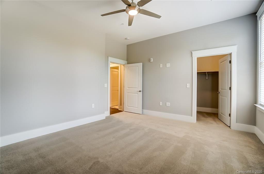 830 Providence Road, Unit 303 Charlotte, NC 28207 - Photo 31 of 39 an empty room with fan and entrance