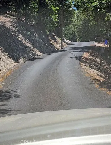 a view of a road with a yard