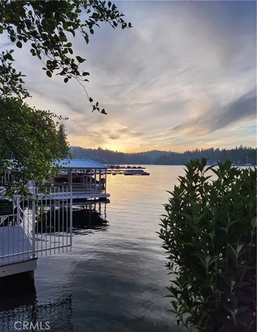 a view of a lake with houses in the back