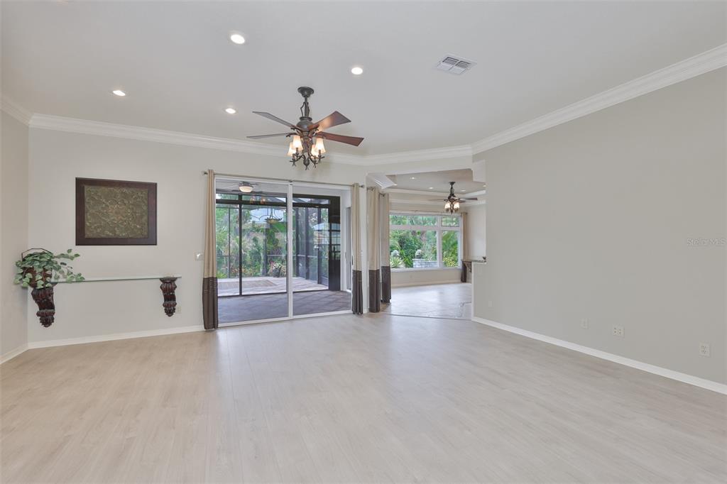 1107 Opal Lane Sun City Center, FL 33573 - Photo 11 of 72 a view of a livingroom with a ceiling fan and window