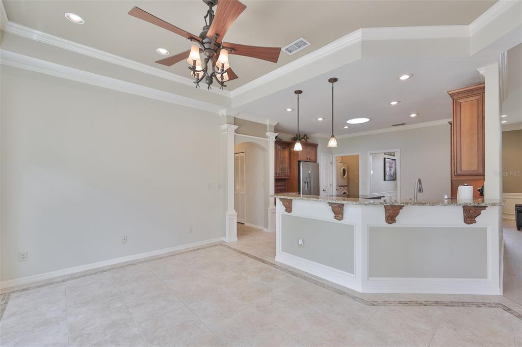 1107 Opal Lane Sun City Center, FL 33573 - Photo 23 of 72 a living room with furniture and a chandelier