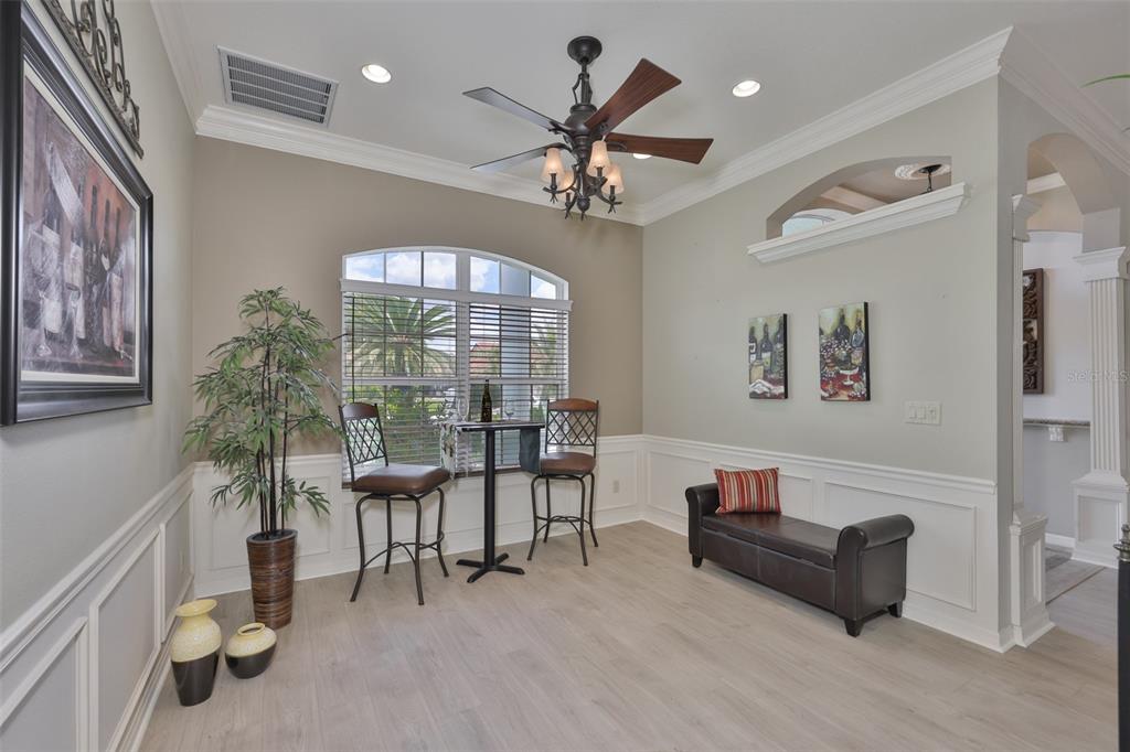 1107 Opal Lane Sun City Center, FL 33573 - Photo 25 of 72 a view of a livingroom with furniture and a ceiling fan