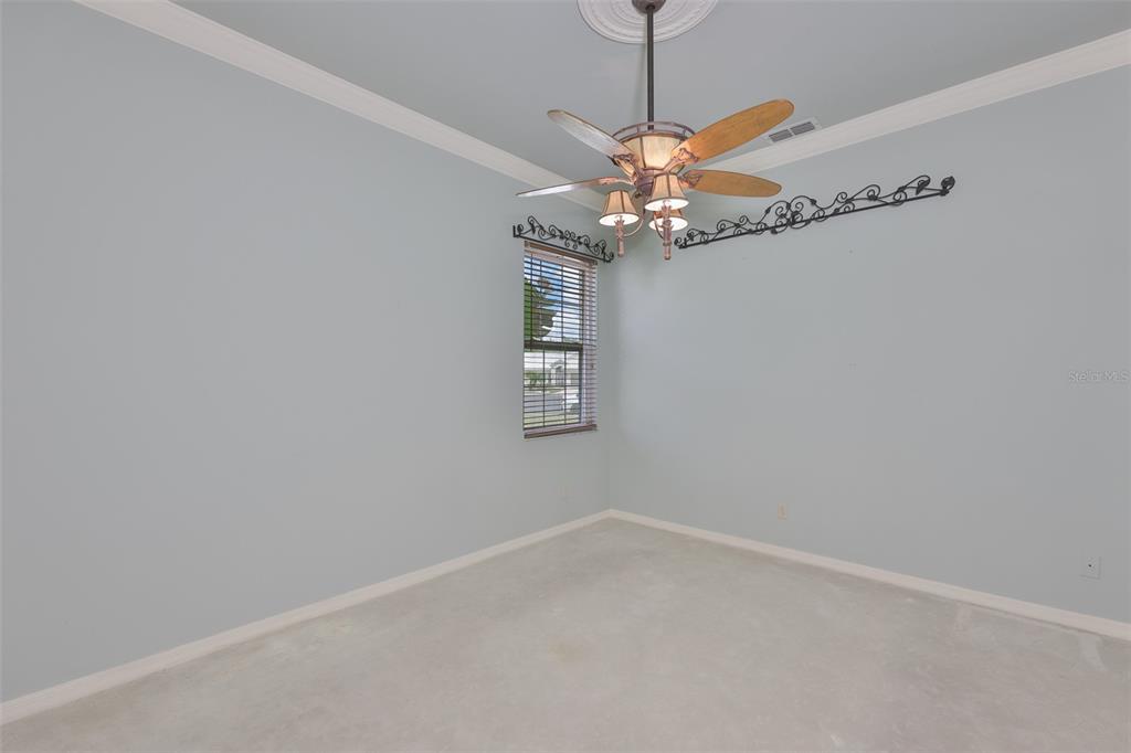 1107 Opal Lane Sun City Center, FL 33573 - Photo 38 of 72 a view of a room with a window and a ceiling fan