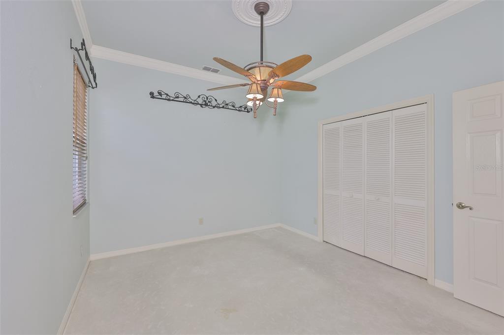 1107 Opal Lane Sun City Center, FL 33573 - Photo 40 of 72 a view of a chandelier fan in a room