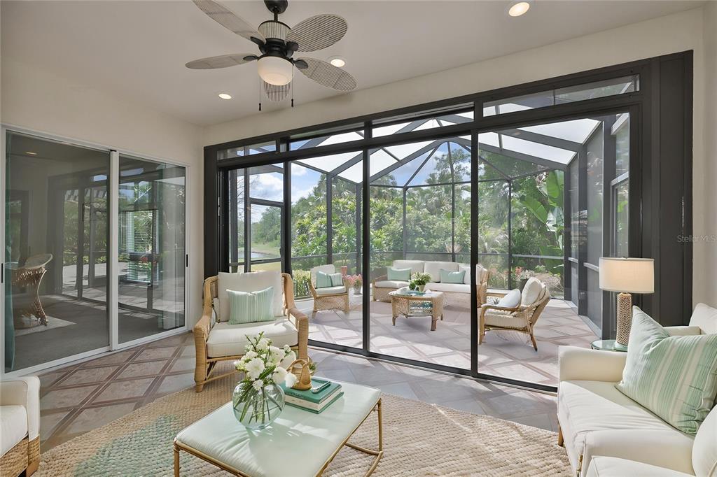 1107 Opal Lane Sun City Center, FL 33573 - Photo 42 of 72 a living room with furniture and a large window