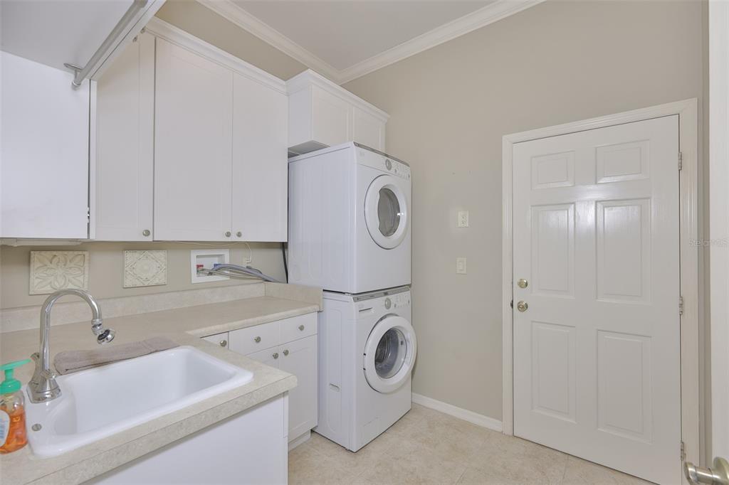 1107 Opal Lane Sun City Center, FL 33573 - Photo 46 of 72 a utility room with sink dryer and washer
