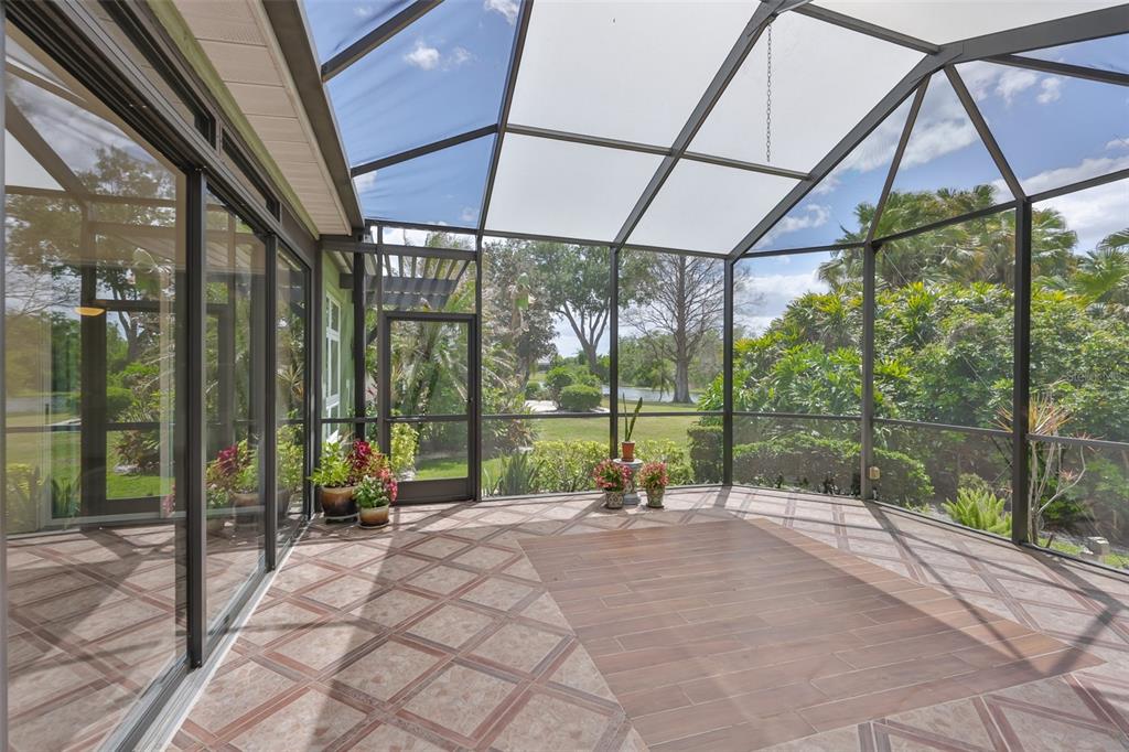 1107 Opal Lane Sun City Center, FL 33573 - Photo 48 of 72 a view of a house with porch and a backyard