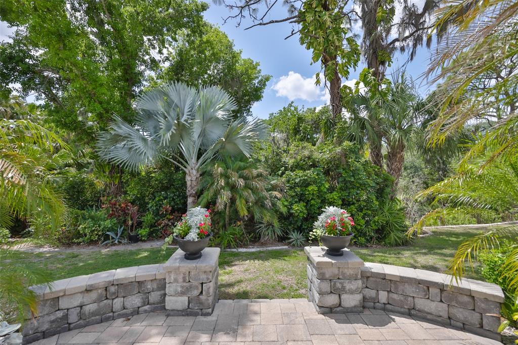 1107 Opal Lane Sun City Center, FL 33573 - Photo 53 of 72 a front view of a house with fountain back yard