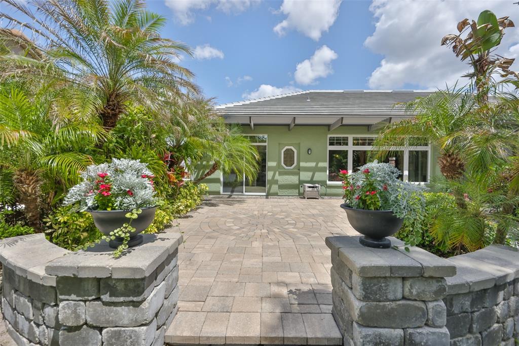 1107 Opal Lane Sun City Center, FL 33573 - Photo 54 of 72 a view of a house with potted plants