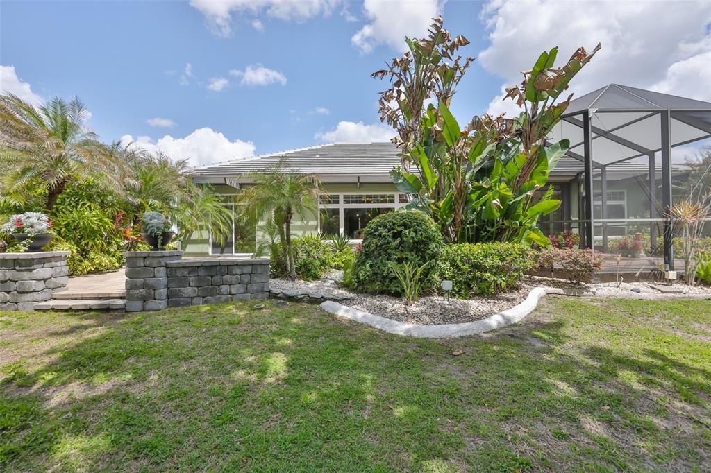 1107 Opal Lane Sun City Center, FL 33573 - Photo 56 of 72 a view of a house with a yard and sitting area