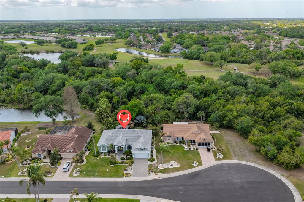 1107 Opal Lane Sun City Center, FL 33573 - Photo 59 of 72 an aerial view of a house with a garden