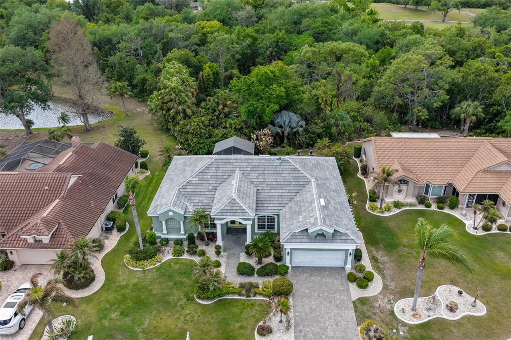 1107 Opal Lane Sun City Center, FL 33573 - Photo 61 of 72 an aerial view of multiple houses with yard