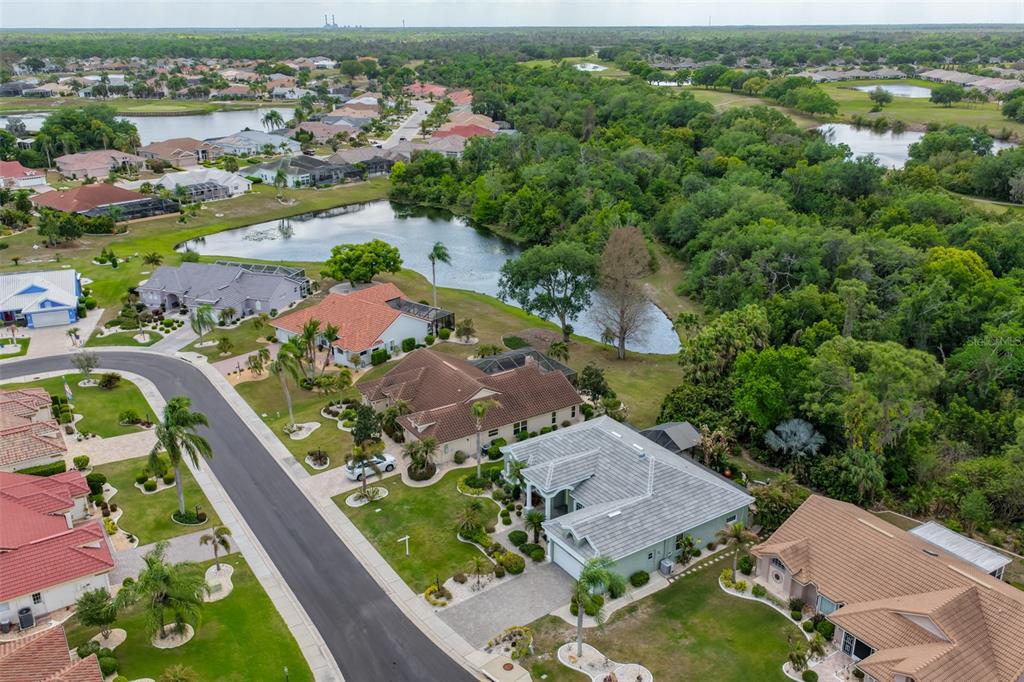 1107 Opal Lane Sun City Center, FL 33573 - Photo 62 of 72 an aerial view of residential houses with outdoor space