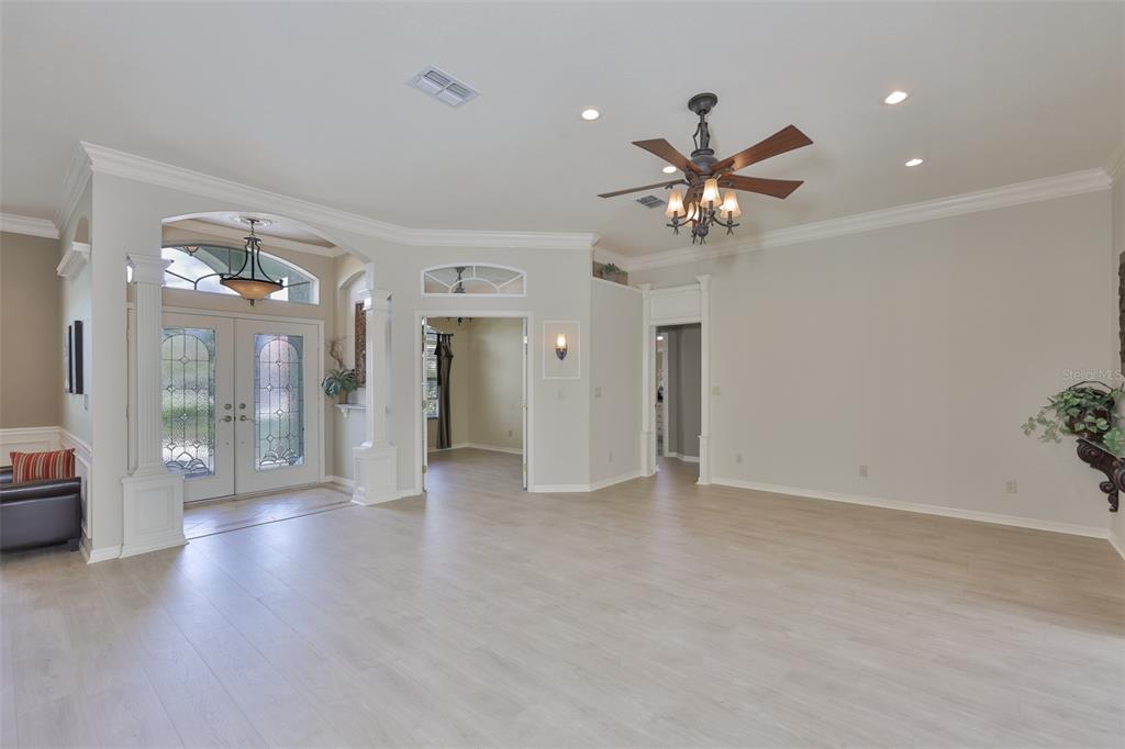 1107 Opal Lane Sun City Center, FL 33573 - Photo 8 of 72 a view of an empty room and a kitchen view