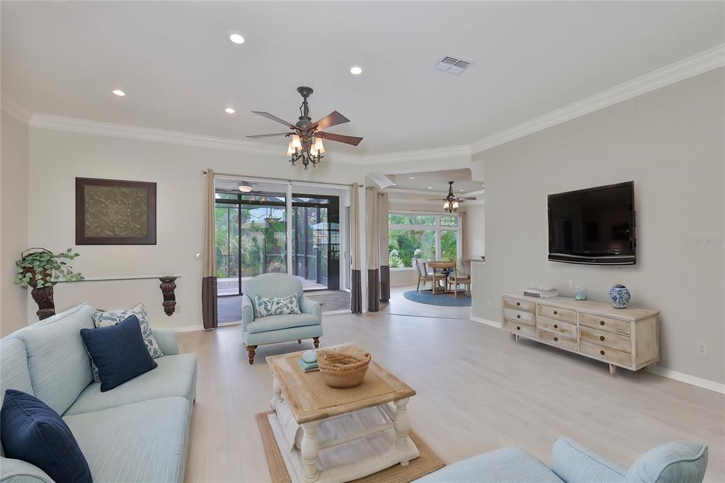 1107 Opal Lane Sun City Center, FL 33573 - Photo 10 of 72 a living room with furniture and a flat screen tv