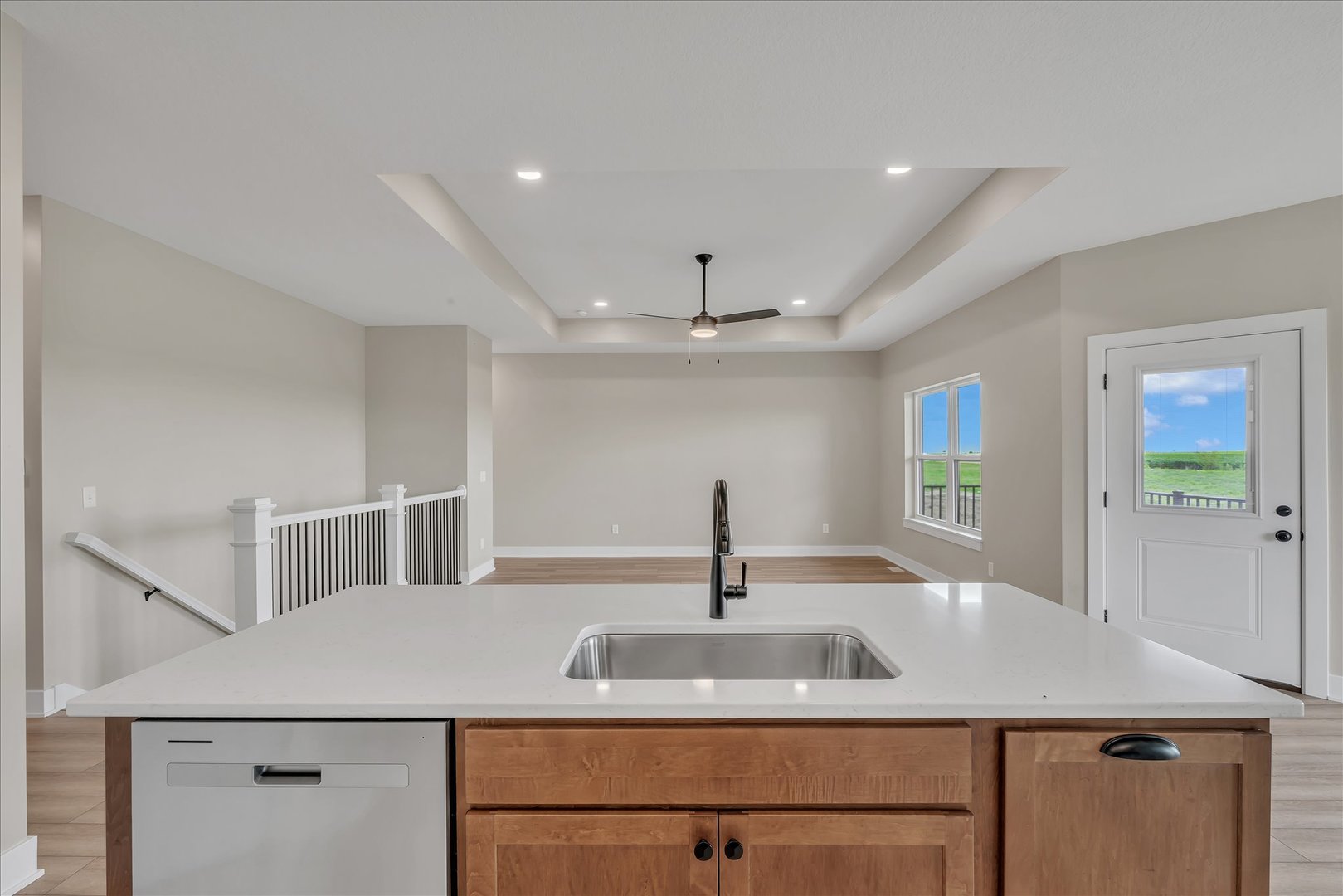 455 Rhonda Road New Liberty, IA 52765 - Photo 24 of 54 a kitchen with a sink and a refrigerator