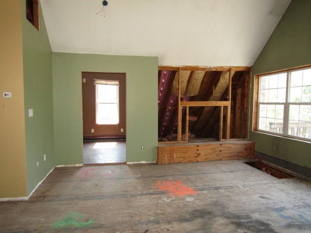 211 Lenkey Road Vanderbilt, PA 15486 - Photo 19 of 38 a view of an empty room with a fireplace and a window
