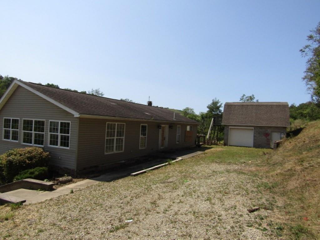 211 Lenkey Road Vanderbilt, PA 15486 - Photo 4 of 38 front view of a house with a yard